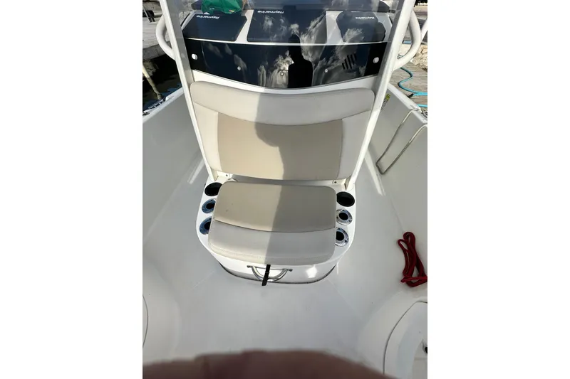 Slide: The Image of 2018 Boston Whaler Dauntless 240 boat seat with cup holders and console. - 4