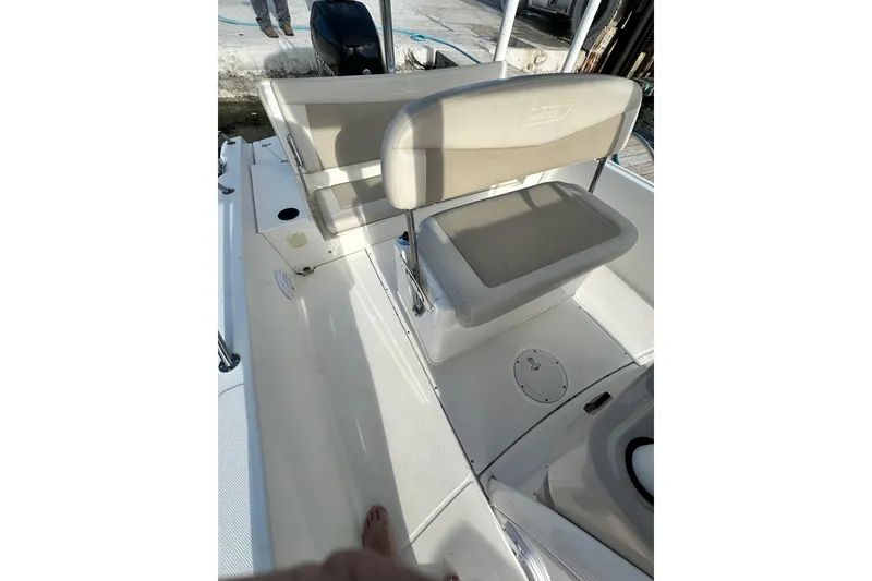 Slide: The Image of 2018 Boston Whaler Dauntless 240 boat interior with seating and deck view. - 5