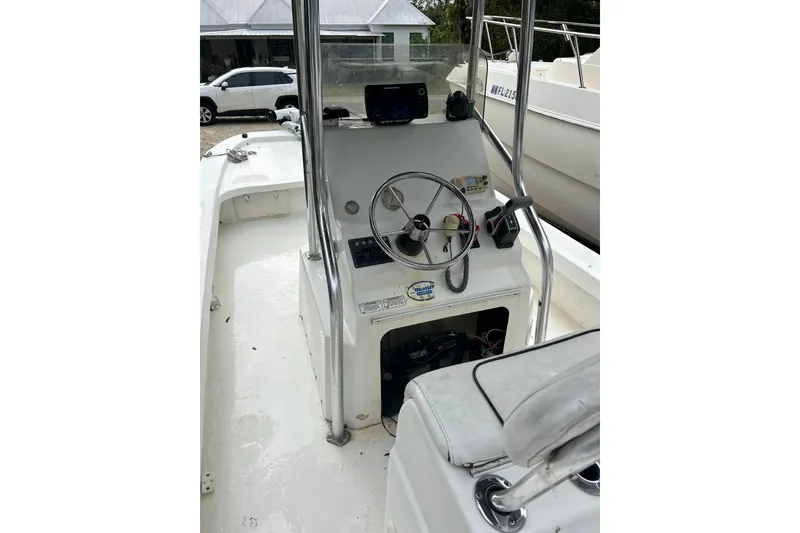 Slide: The Image of 2017 Twin Vee 22 BayCat boat interior with steering console and seating. - 5