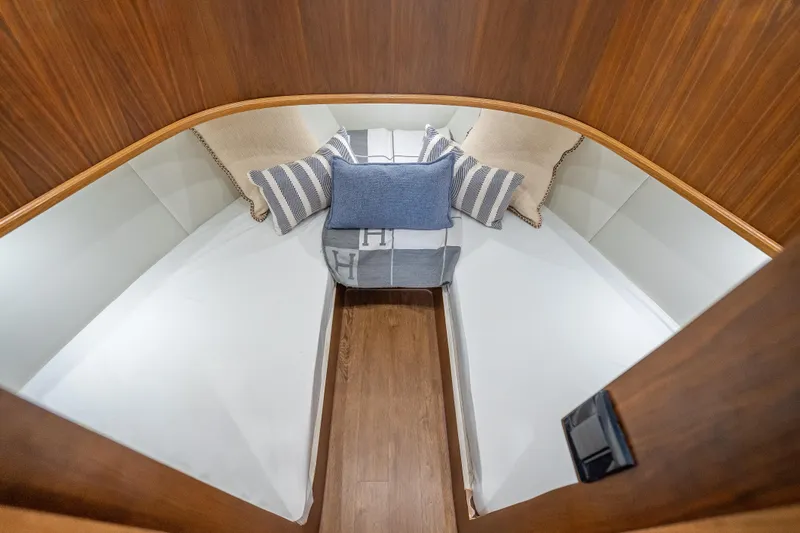 Slide: The Image of Luxurious cabin interior of 2025 Rybovich Custom Margaritavich yacht with cozy bedding. - 26