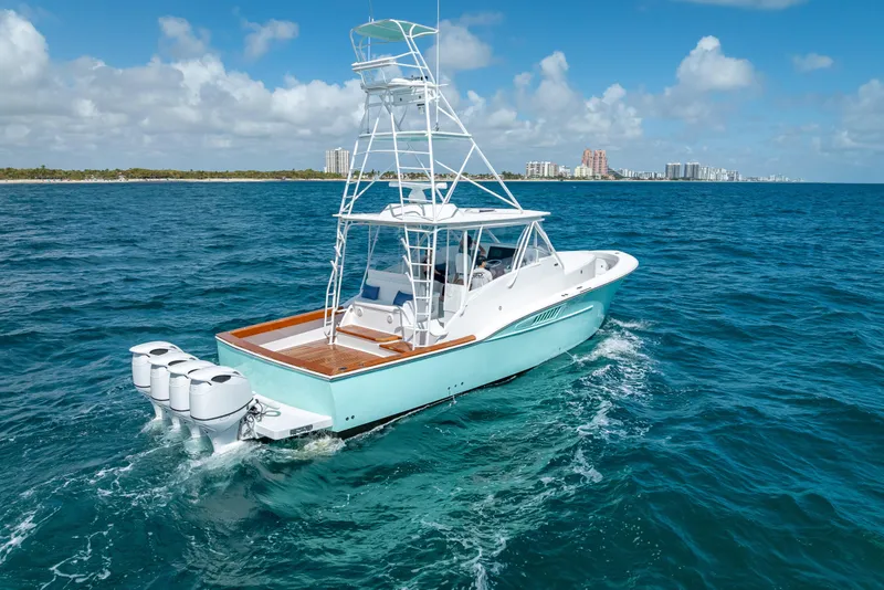 Slide: The Image of 2025 Rybovich Custom Margaritavich boat cruising on blue ocean waters. - 3