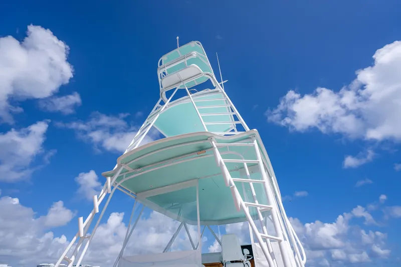 Slide: The Image of Custom Margaritavich 2025 boat tower against a vibrant blue sky with clouds. - 43