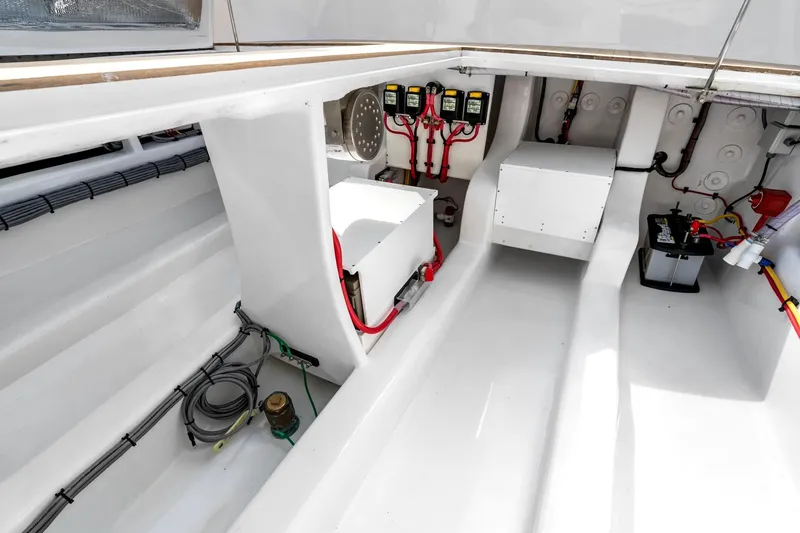 Slide: The Image of 2025 Rybovich Custom Margaritavich boat interior with electrical components and wiring. - 48