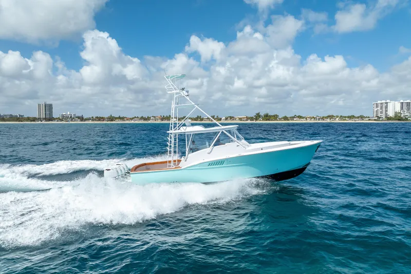 Slide: The Image of 2025 Rybovich Custom Margaritavich yacht cruising on blue ocean under clear sky. - 51