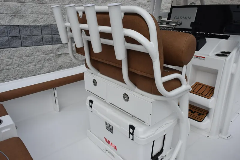 Slide: The Image of 2026 Sea Hunt BX 22 BR boat interior with brown seating and rod holders. - 11