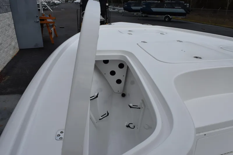 Slide: The Image of 2026 Sea Hunt BX 22 BR boat deck with storage compartments, docked outdoors. - 16