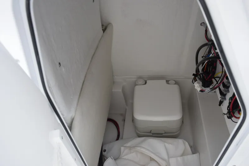Slide: The Image of 2026 Sea Hunt BX 22 BR boat interior with storage compartment and wiring. - 17
