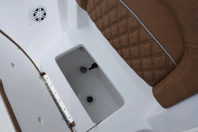 Slide: The Image of 2026 Sea Hunt BX 22 BR boat interior with brown quilted seating and storage compartment. - 18