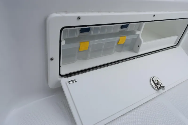 Slide: The Image of Storage compartment on 2026 Sea Hunt BX 22 BR boat with secure latch and organizer. - 20