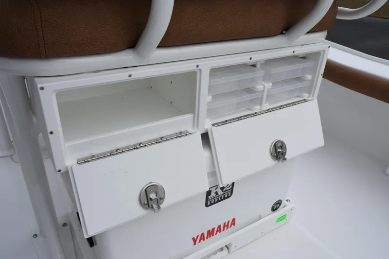 Slide: The Image of 2026 Sea Hunt BX 22 BR boat storage compartments with Yamaha branding and K2 cooler. - 23