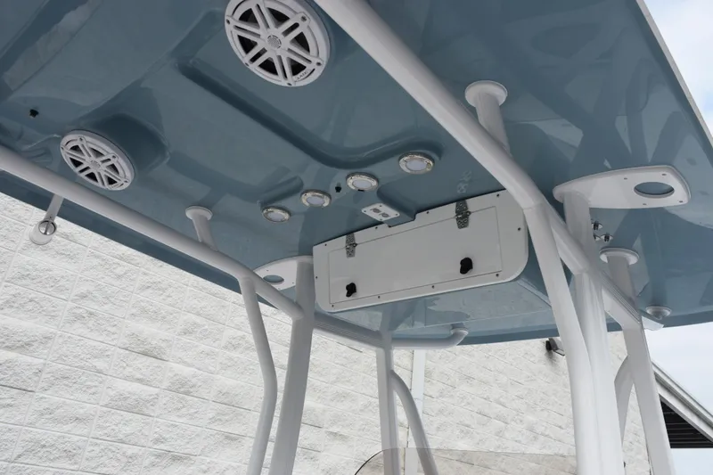 Slide: The Image of T-top of 2026 Sea Hunt BX 22 BR boat with speakers and lights. - 9