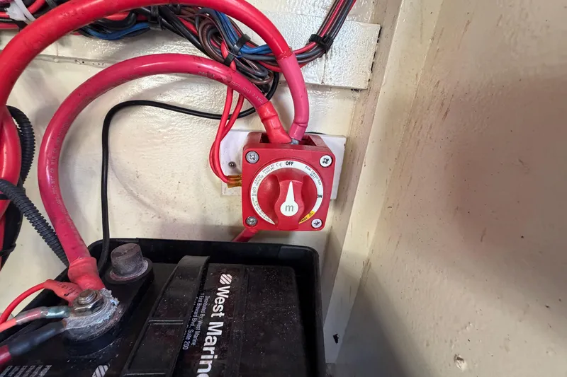 Slide: The Image of Battery switch and wiring in a 2024 Custom Florida Flats CC boat. - 25