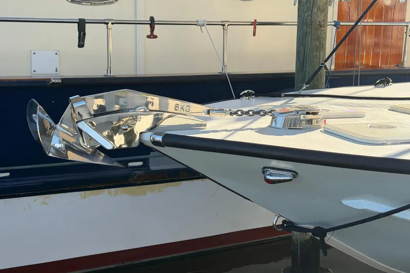 Slide: The Image of 2024 Custom Florida Flats CC boat with shiny anchor and chain on deck. - 36