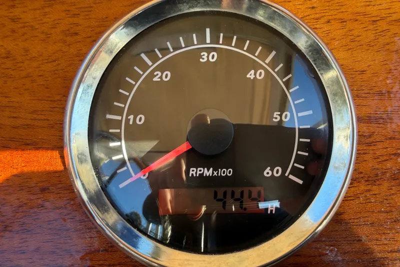 Slide: The Image of Close-up of a 2024 Custom Florida Flats CC tachometer, showing RPM and engine hours. - 9