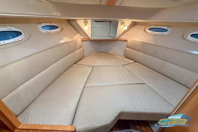 Slide: The Image of 2013 Cutwater C-28 boat bathroom with blue sink, toilet, and mirror. - 26