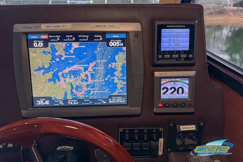 Slide: The Image of 2013 Cutwater C-28 helm with navigation controls and cushioned seating. - 36