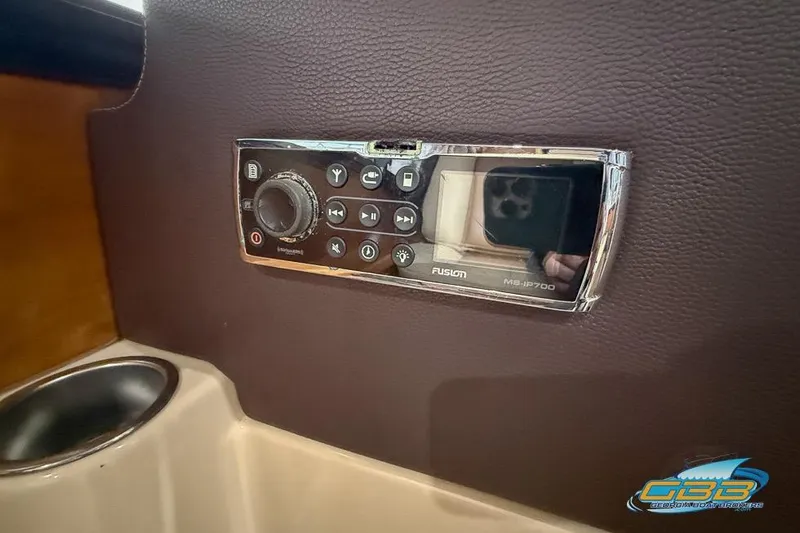 Slide: The Image of 2013 Cutwater C-28 interior with open refrigerator, wooden flooring, and countertop. - 53