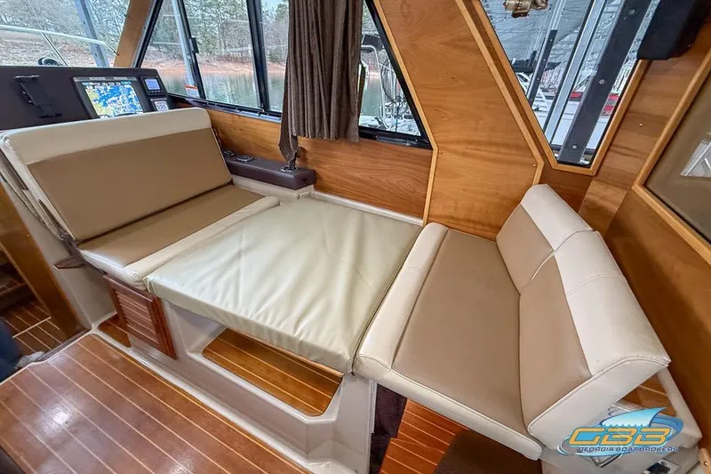 Slide: The Image of Interior ceiling of a 2013 Cutwater C-28 boat with wood paneling and skylights. - 56