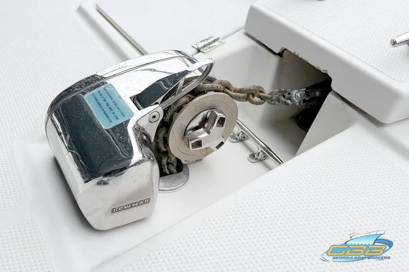 Slide: The Image of 2013 Cutwater C-28 boat docked in a covered marina with blue underwater lights. - 80