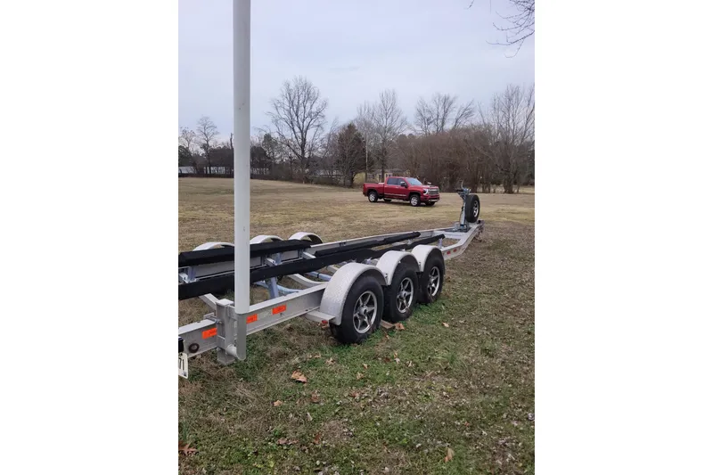 Slide: The Image of Trailer for 2013 Cutwater C-28 boat with red truck in background. - 86