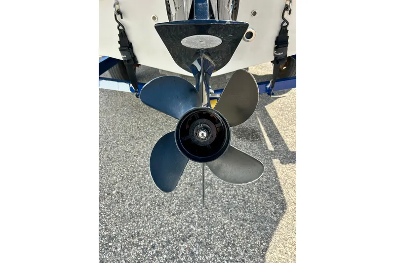 Slide: The Image of 2018 Starcraft 2000 OB Limited boat propeller on pavement background. - 11