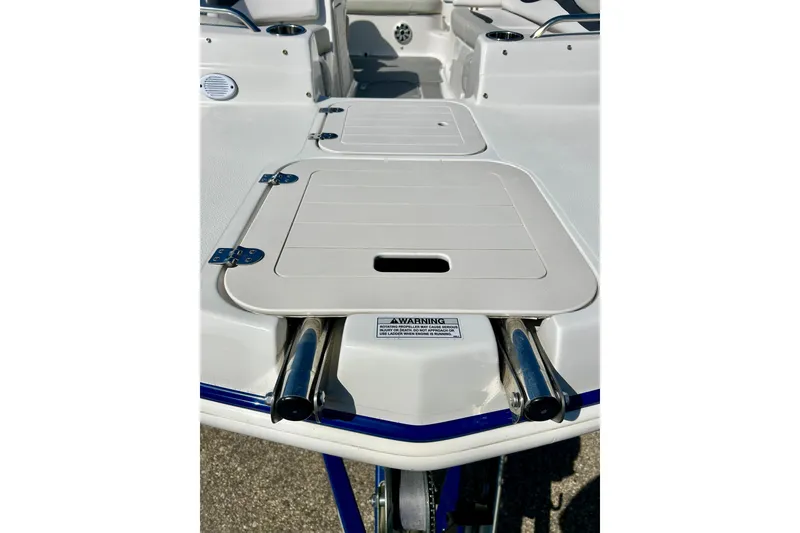 Slide: The Image of 2018 Starcraft 2000 OB Limited boat deck with storage compartments and stainless steel fittings. - 13