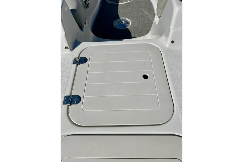 Slide: The Image of 2018 Starcraft 2000 OB Limited boat deck with storage hatch and stainless steel hinges. - 16