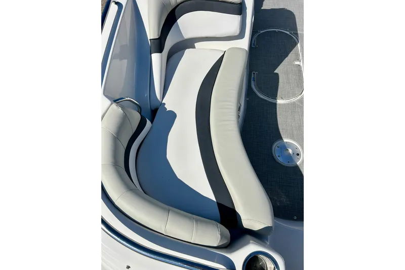 Slide: The Image of 2018 Starcraft 2000 OB Limited boat interior with cushioned seating and gray flooring. - 19