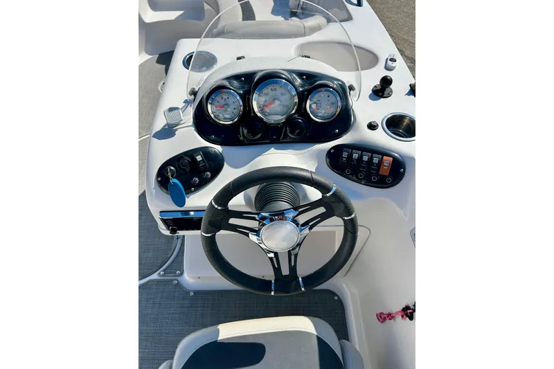 Slide: The Image of Steering console of 2018 Starcraft 2000 OB Limited boat with gauges and controls. - 24