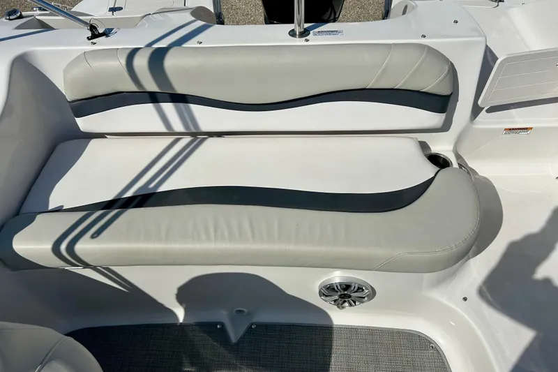 Slide: The Image of 2018 Starcraft 2000 OB Limited boat seating with gray and white upholstery. - 30