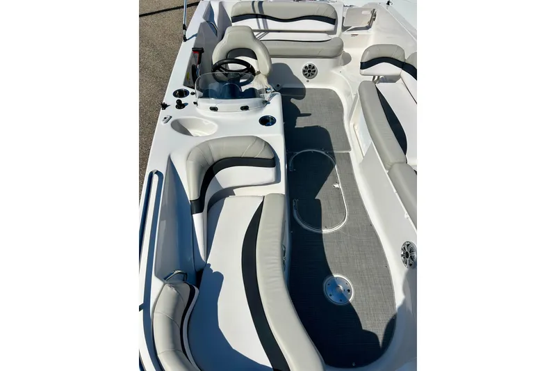 Slide: The Image of 2018 Starcraft 2000 OB Limited boat interior with gray seating and steering console. - 39