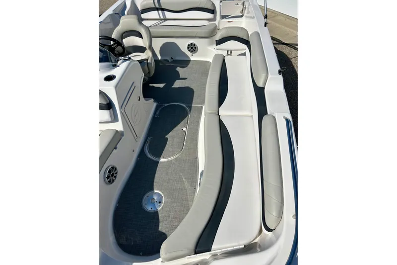 Slide: The Image of 2018 Starcraft 2000 OB Limited boat interior with gray seating and carpet. - 40