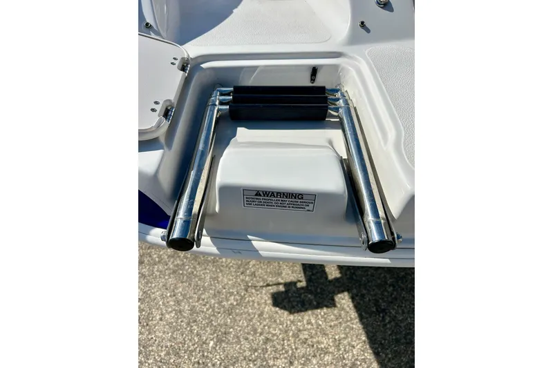 Slide: The Image of 2018 Starcraft 2000 OB Limited boat ladder with safety warning label. - 45