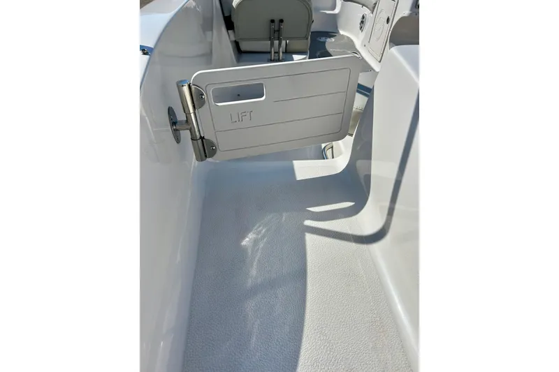 Slide: The Image of 2018 Starcraft 2000 OB Limited boat interior with lift gate detail. - 46