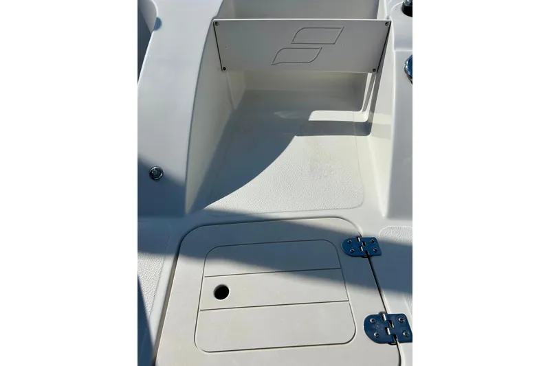 Slide: The Image of 2018 Starcraft 2000 OB Limited boat interior with storage compartment and sleek design. - 48