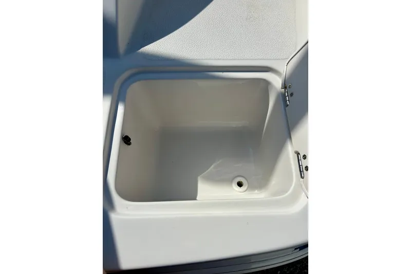 Slide: The Image of 2018 Starcraft 2000 OB Limited boat storage compartment, open and empty. - 49