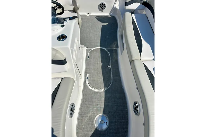 Slide: The Image of 2018 Starcraft 2000 OB Limited boat interior with gray flooring and white seating. - 50