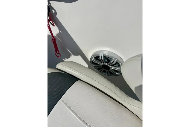 Slide: The Image of 2018 Starcraft 2000 OB Limited boat interior with speaker and seating detail. - 56