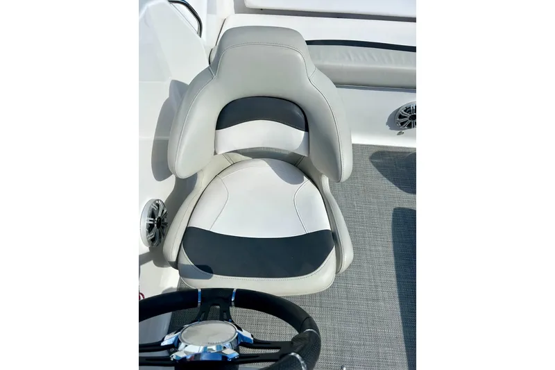 Slide: The Image of Captain's seat in 2018 Starcraft 2000 OB Limited boat, featuring sleek design and comfortable upholstery. - 57