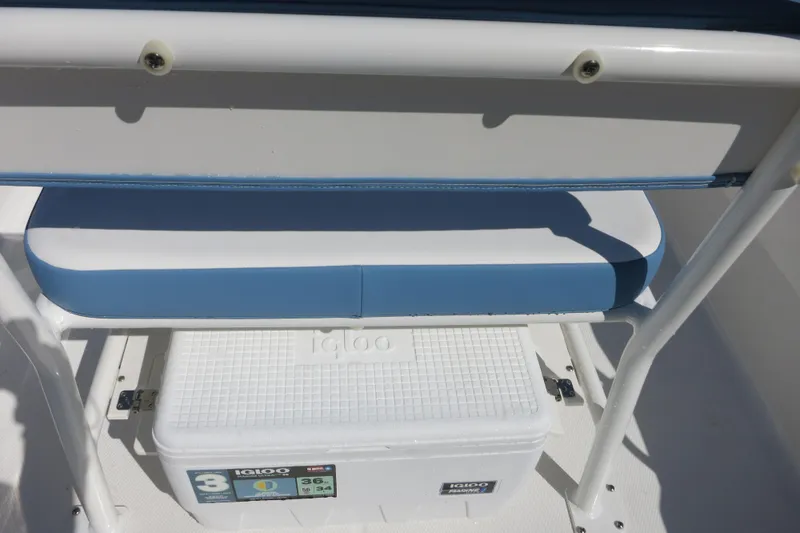 Slide: The Image of 2026 Robalo R160 Center Console boat seat with Igloo cooler storage. - 11