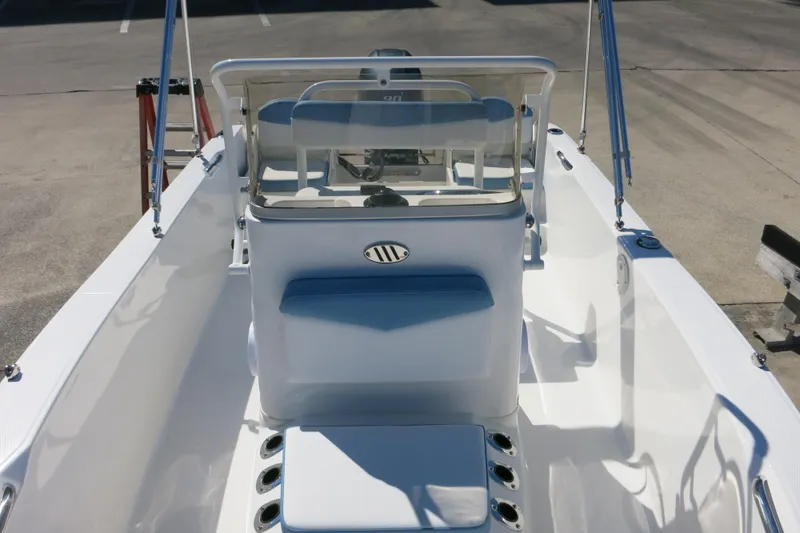 Slide: The Image of 2026 Robalo R160 Center Console boat interior with seating and steering console. - 15