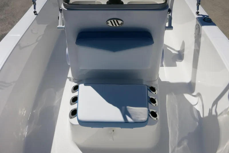 Slide: The Image of 2026 Robalo R160 Center Console boat interior with seating and rod holders. - 16