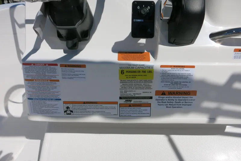 Slide: The Image of 2026 Robalo R160 Center Console dashboard with safety and capacity warnings. - 20