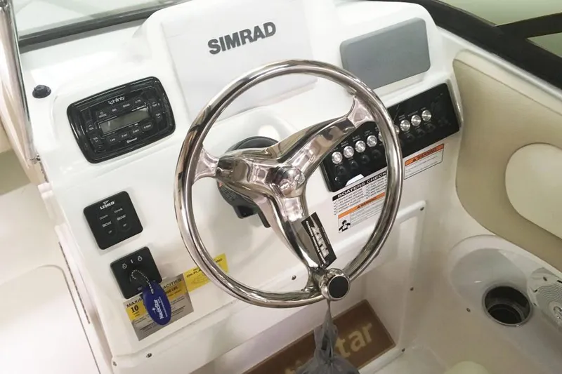 Slide: The Image of Manufacturer Provided Image: 2018 NauticStar 2302 Legacy Dual Console boat dashboard with Simrad electronics and steering wheel. - 10