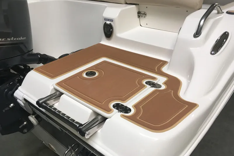 Slide: The Image of Manufacturer Provided Image: 2018 NauticStar 2302 Legacy Dual Console boat deck with brown non-slip mats. - 8