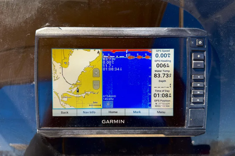 Slide: The Image of Garmin GPS display on 2023 Scout 215 Dorado boat, showing navigation and water temperature. - 16