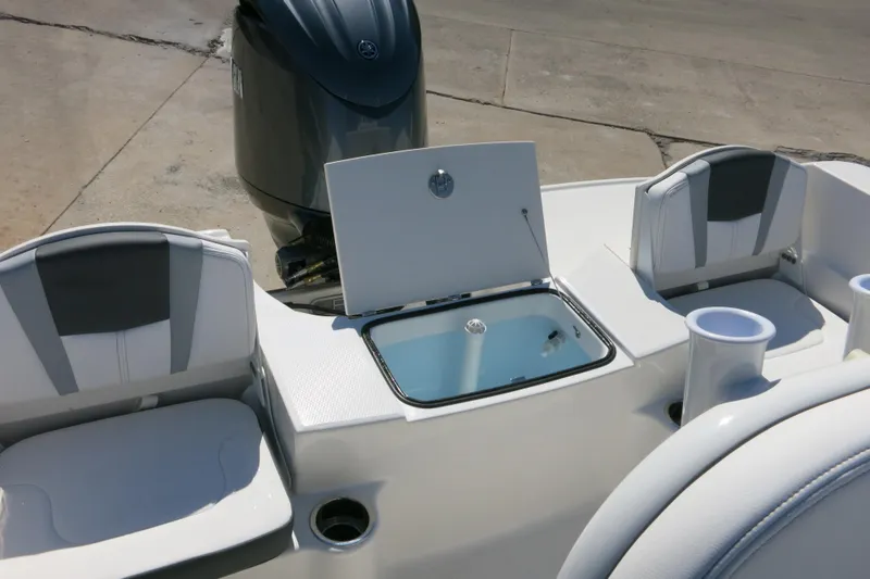 Slide: The Image of 2026 Robalo R180 Center Console boat interior with seating and storage compartments. - 11