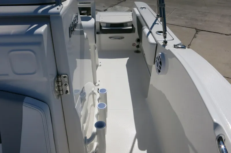 Slide: The Image of 2026 Robalo R180 Center Console boat interior with rod holders and seating. - 16