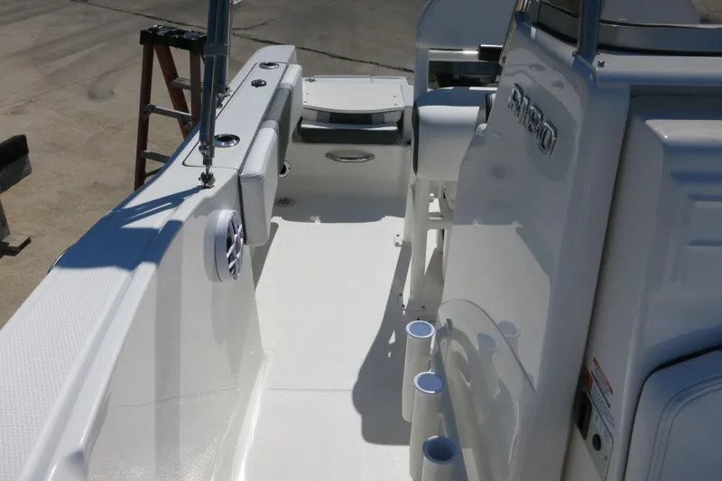 Slide: The Image of 2026 Robalo R180 Center Console boat interior with rod holders and seating. - 17