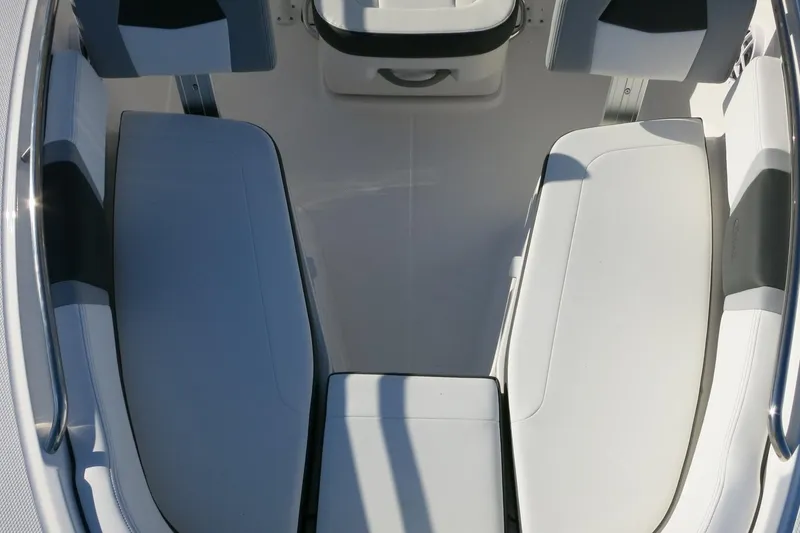 Slide: The Image of 2026 Robalo R200 Center Console boat interior with cushioned seating and sleek design. - 13